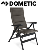 Dometic Cortina reclining chair in shale fabric, featuring a comfortable padded seat and armrests for relaxing seating.