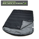 Outdoor Revolution SunStar Double 300 sleeping bag shown in a natural outdoor setting, highlighting its spacious design and durable material.