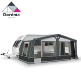 Dorema Air Seasonal Caravan Awning set up, showcasing its spacious design and air-filled structure in a scenic outdoor setting.