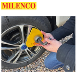 Milenco Alpha Gold Wheel Lock secured on a wheel, showcasing its durable design and bright yellow color.