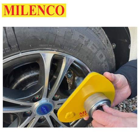 Milenco Alpha Gold Wheel Lock secured on a wheel, showcasing its durable design and bright gold color.