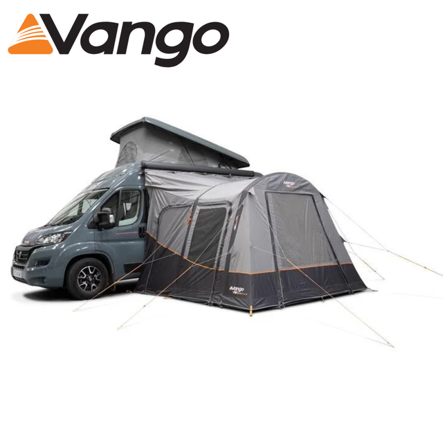 Vango Faros III Air Mid Driveaway Awning with inflatable structure set up beside a camper van in a scenic outdoor setting.