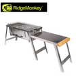 RidgeMonkey Grilla BBQ Dual Fuel grill with stainless steel body, cooking grates, and control knobs for versatile outdoor grilling.