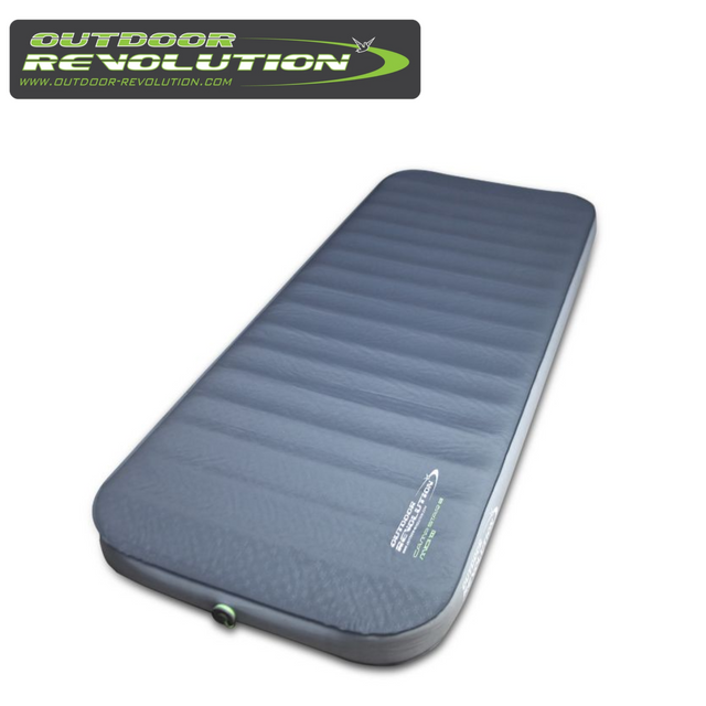 Outdoor Revolution Camp Star Midi 100 self-inflating mat in a spacious outdoor setting with rolled-up design visible.