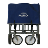 Lifestyle Palmo Wagon with sturdy wooden handles and spacious green fabric basket for versatile outdoor use.