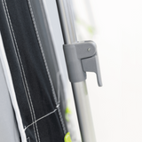 Dometic Rally Tour poled awning with sturdy poles set up for outdoor use, showcasing its spacious canopy and design.