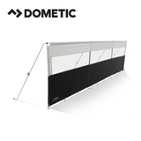 Dometic Pro Poled Windbreak set up with poles, providing shelter and privacy in an outdoor camping setting.