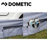 Dometic Pro Organiser Shirt awning skirt attached to a camper or RV, showcasing its durable fabric and secure fit.
