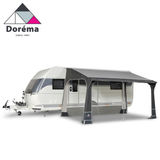 Dorema Quartz 400 Deluxe Porch Awning showcasing a spacious design with a sturdy frame and fabric in a natural setting.