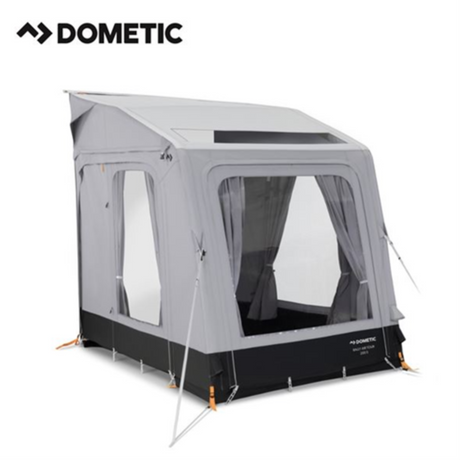 Dometic Rally Air Tour 200 air awning set up outside a campervan, showcasing its spacious design and durable fabric.