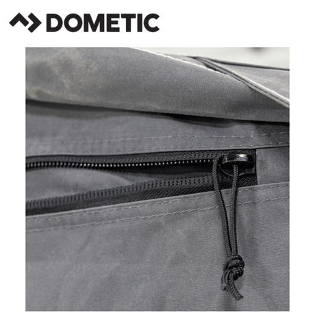 Dometic Rally Air Stay 260s Awning installed on a camper, showcasing its durable fabric and retractable side panels.