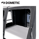 Dometic Rally Air Stay 260s Awning set up outside a camper, showcasing the durable fabric and airframe structure.