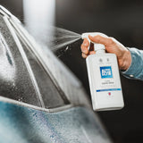 Autoglym Rapid Aqua Wax Kit for vehicles, featuring a spray bottle and applicator cloth for easy car waxing.