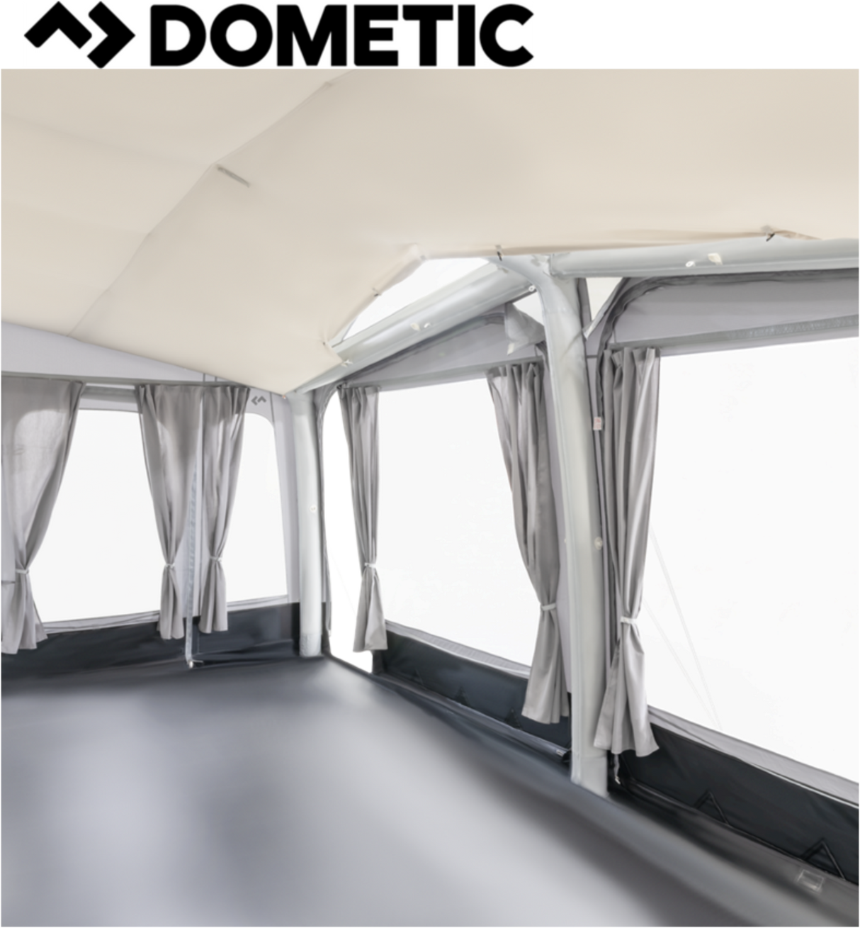 Dometic Residence Air Tour Awning set up, showcasing its spacious canopy and air-filled structure in a sunny outdoor setting.