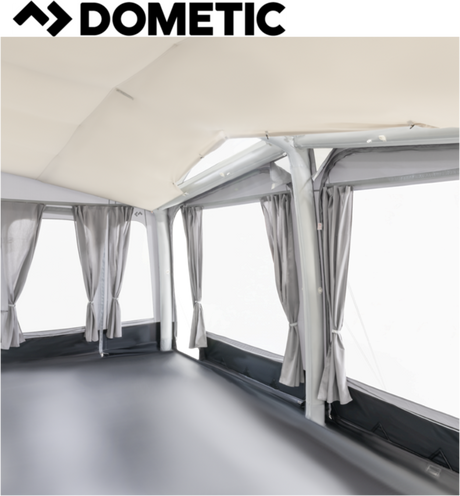 Dometic Residence Air Tour Awning set up, showcasing its spacious canopy and air-filled structure in a sunny outdoor setting.
