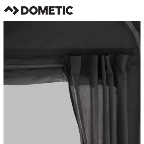 Dometic Residence Air Stay awning attached to a camper, providing shaded outdoor space with fabric and support poles.