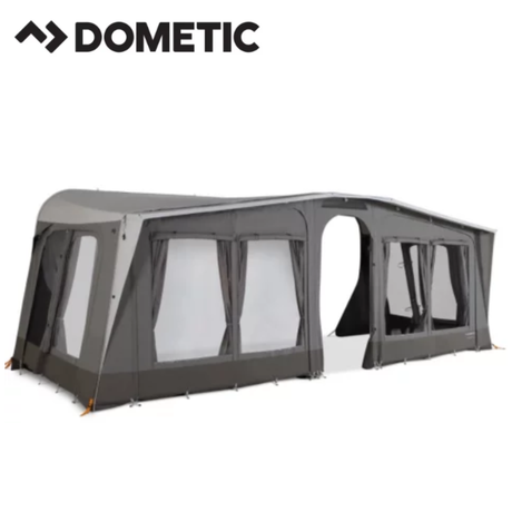 Dometic Stuga Rest Awning attached to a camper, providing shade and shelter, with fabric and support poles visible.
