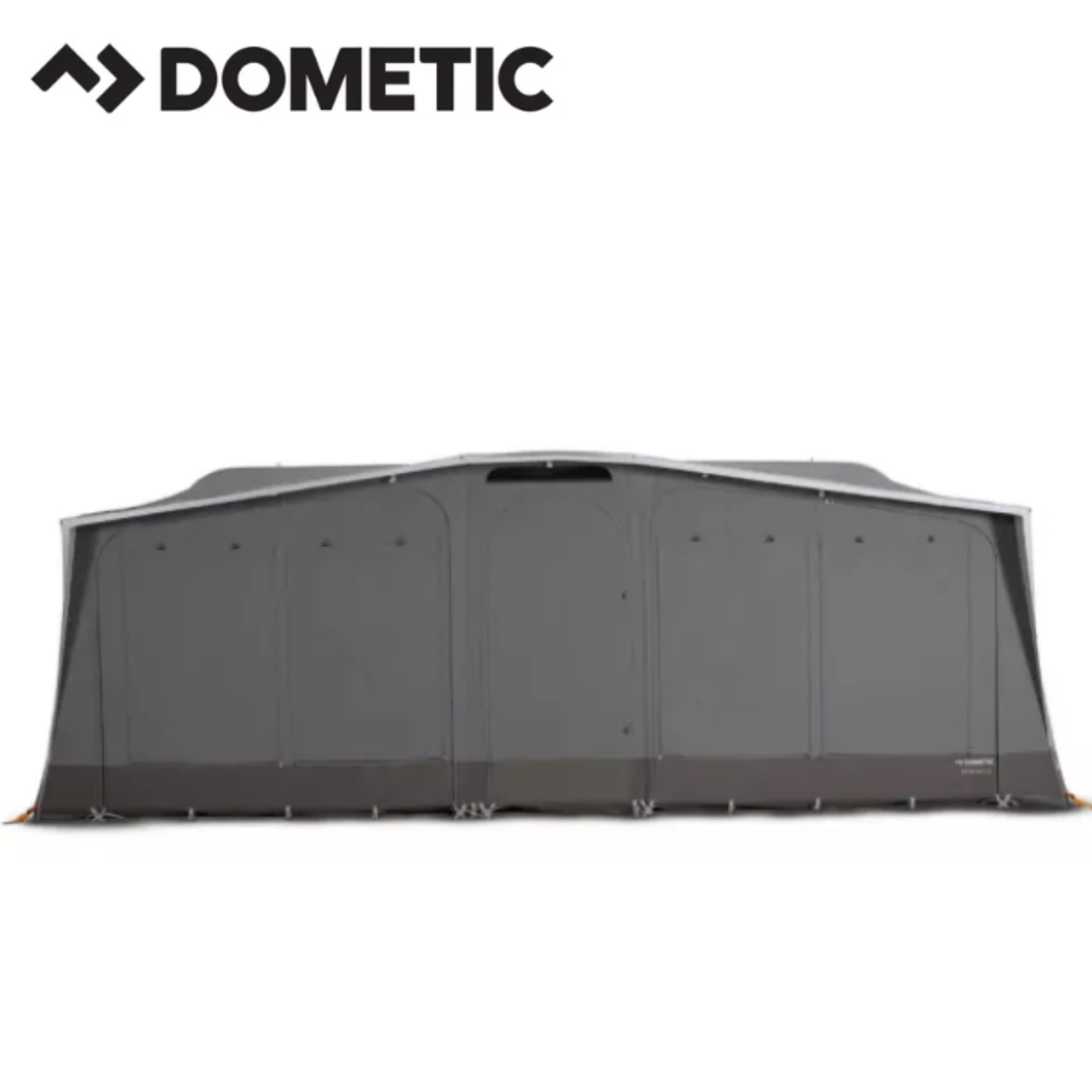 Dometic Stuga Rest Awning extends from a camper, showing its fabric canopy and support poles for outdoor shade and shelter.