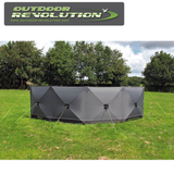 Outdoor Revolution Pronto Tensile Active 4 Panel Windbreak set up in a scenic outdoor location, providing wind protection.
