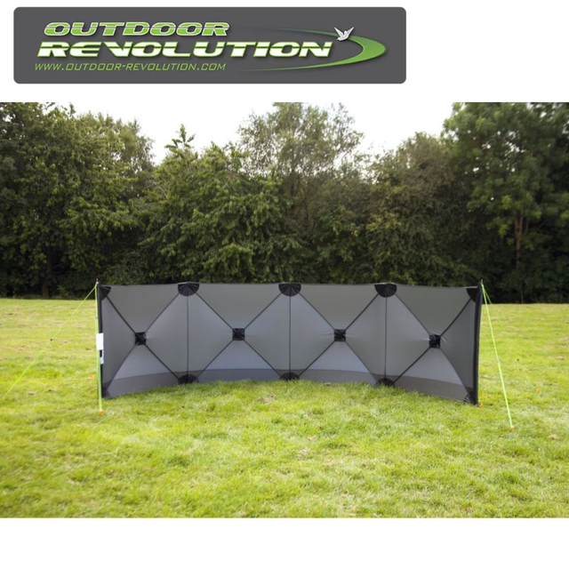 Outdoor Revolution Pronto Tensile Active 4 Panel Windbreak set up in a grassy area, providing shelter from the wind.