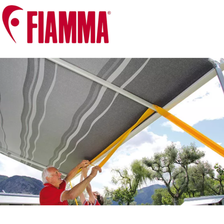 Fiamma tie down kit for awnings up to 6 meters, black or yellow, with straps and hardware for secure outdoor installation.