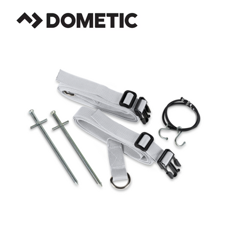 Dometic Storm Tie Down Kit in Mist color, featuring durable straps and anchors for securing outdoor equipment.