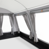 Dometic Rally Tour Poled Awning set up outside, showcasing its sturdy poles and spacious canopy for outdoor shade.