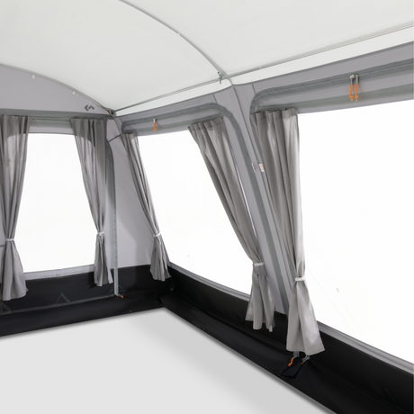 Dometic Rally Tour Poled Awning set up outside, showcasing its sturdy poles and spacious canopy for outdoor shade.