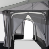 Dometic Tour Air Tall Annexe with inner tent set up in a campsite, showcasing spacious design and durable materials.