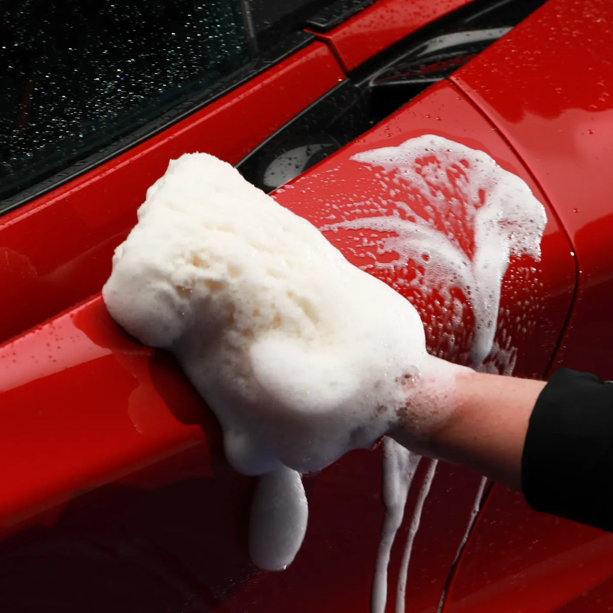 Autoglym UHD Shampoo bottle with label, showcasing its sleek design for effective vehicle cleaning.