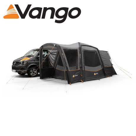 Vango Versos Air Low Driveaway Awning set up beside a campervan in a scenic outdoor setting.