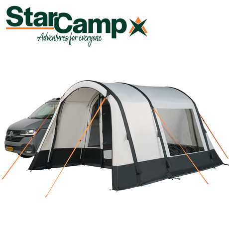 Dorema StarCamp Voyager Air Driveaway Awning set up beside a camper van on a sunny day.