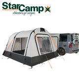 Dorema StarCamp Voyager Air driveaway awning set up beside a campervan, showcasing its spacious design and weather-resistant fabric.