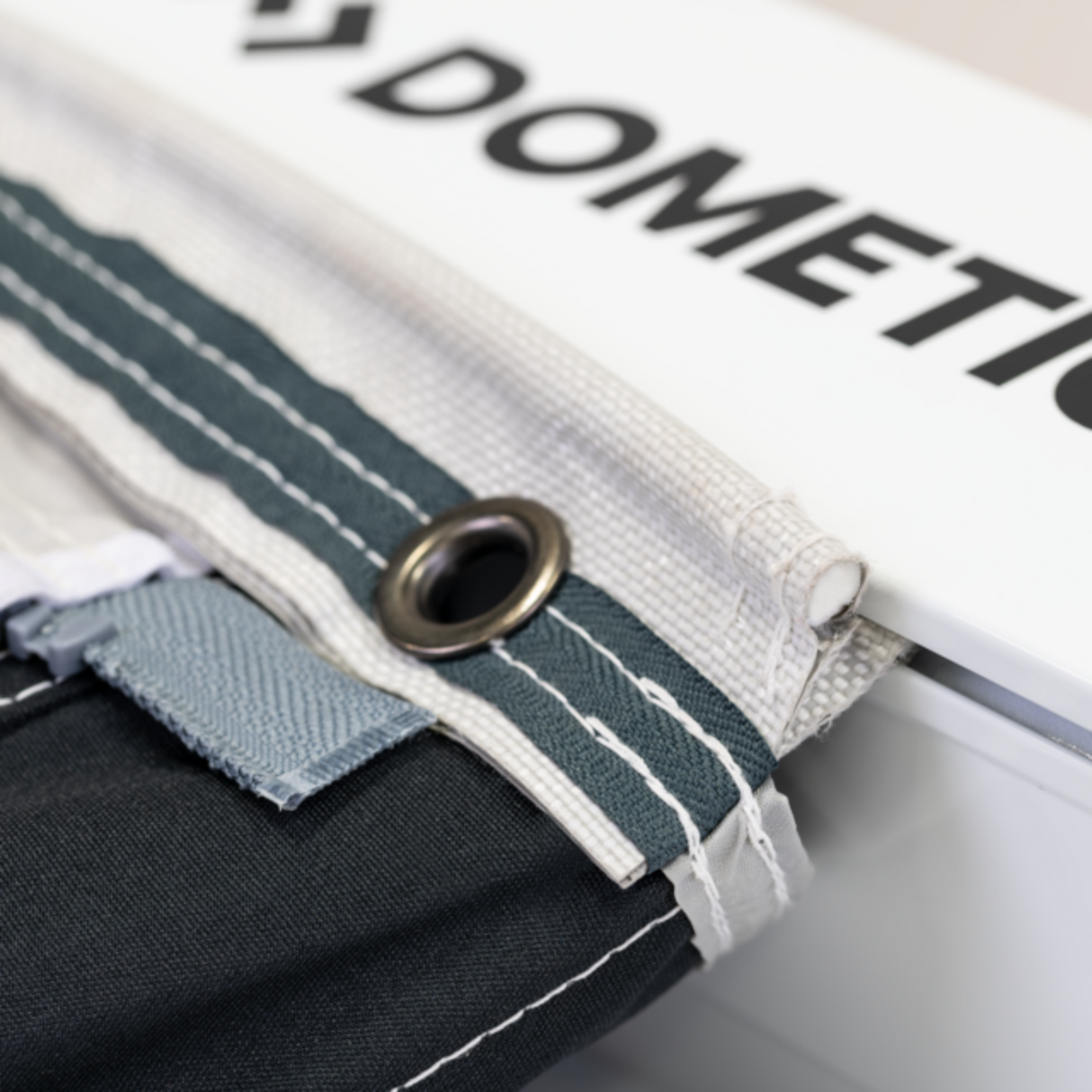 Dometic Sunshine Air Tour air canopy set up in a snowy winter landscape, providing shade and shelter outdoors.