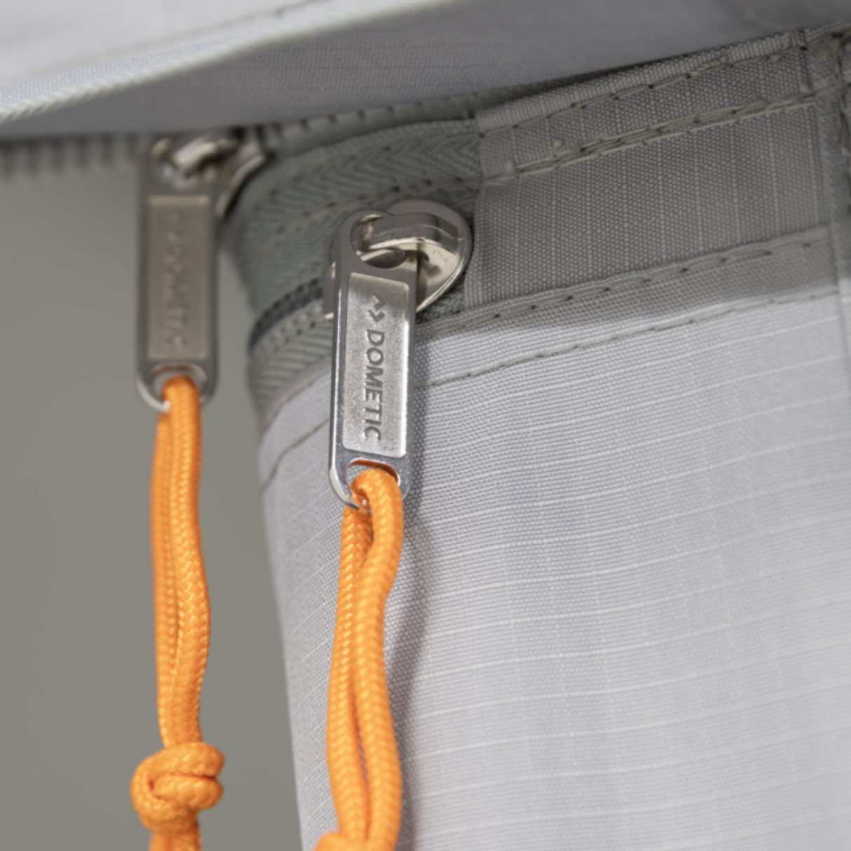 Dometic Sunshine Tour air canopy with front and side panels displayed in outdoor setting, showcasing its design and features.